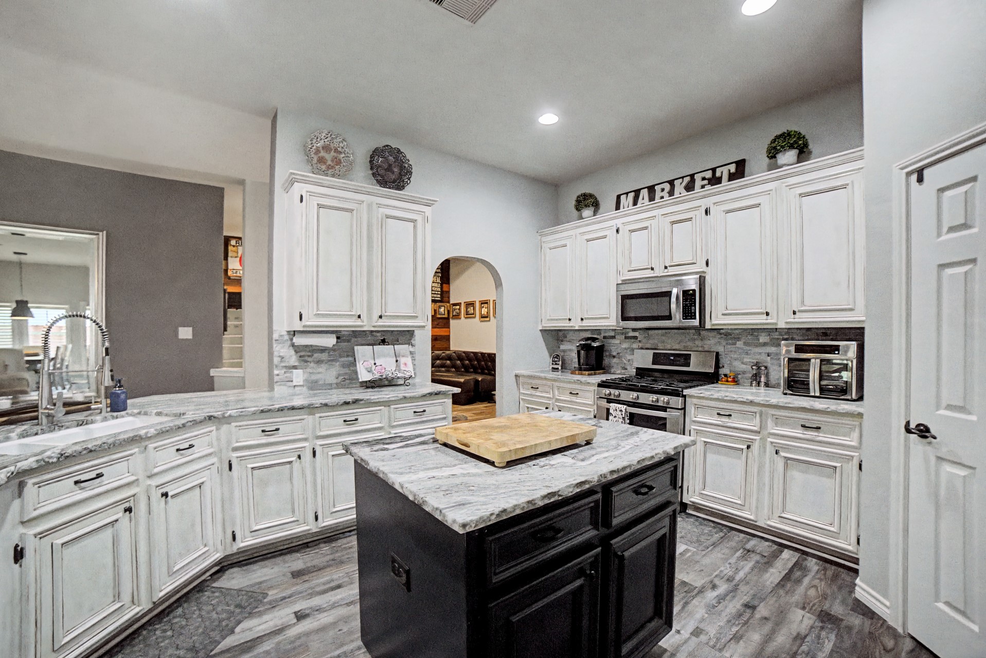 28411 Peper Hollow Lane Spring, TX 77386 - Photo 9 of 24 a kitchen with stainless steel appliances granite countertop a stove top oven a sink dishwasher and a refrigerator with the cabinets
