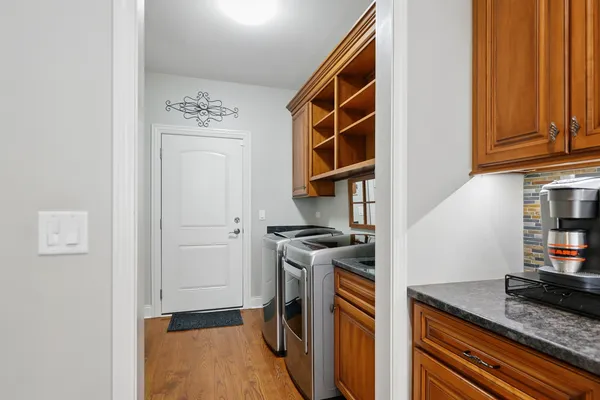 a kitchen with stainless steel appliances granite countertop a stove and a refrigerator
