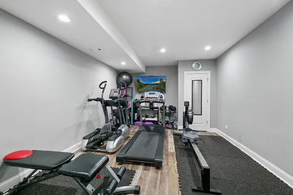 a room with wooden floor and furniture