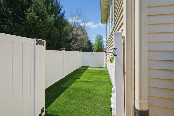 a view of a deck with wooden floor and furniture