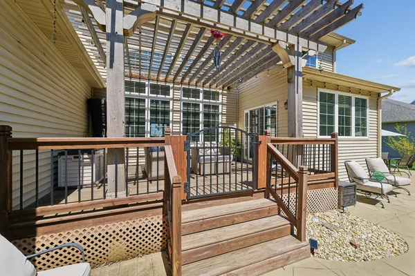 a view of a backyard with furniture and outdoor seating