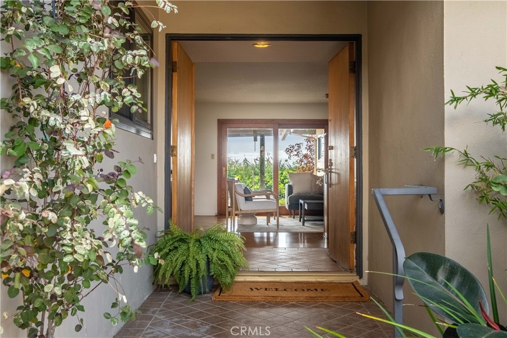 2727 San Ramon Drive Rancho Palos Verdes, CA 90275 - Photo 17 of 58 a view of a porch with chairs and potted plants
