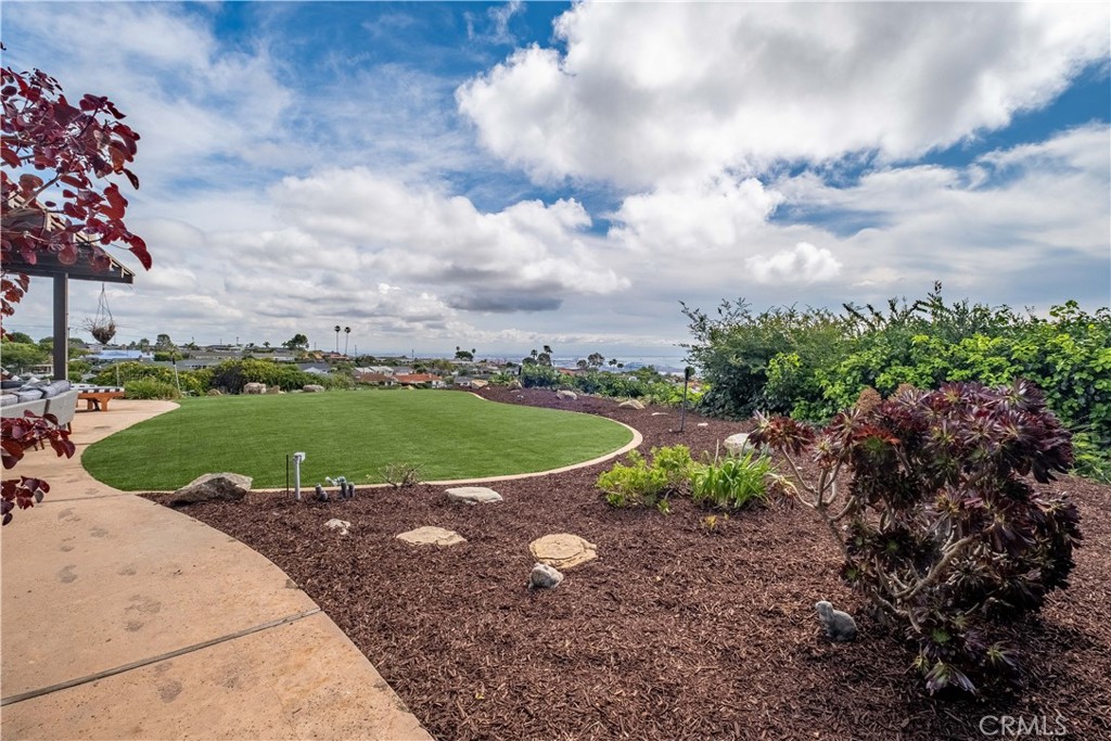 2727 San Ramon Drive Rancho Palos Verdes, CA 90275 - Photo 18 of 58 a view of a garden with a building in the background