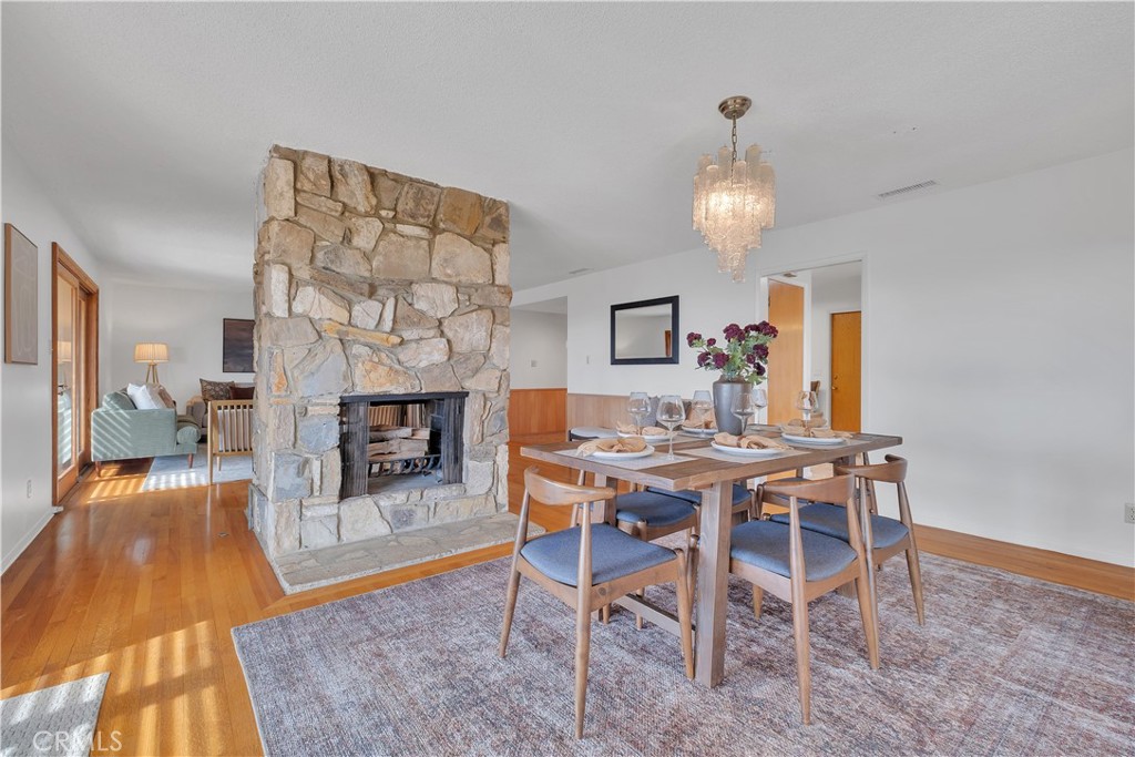 2727 San Ramon Drive Rancho Palos Verdes, CA 90275 - Photo 25 of 58 a view of a dining room with furniture a chandelier and wooden floor