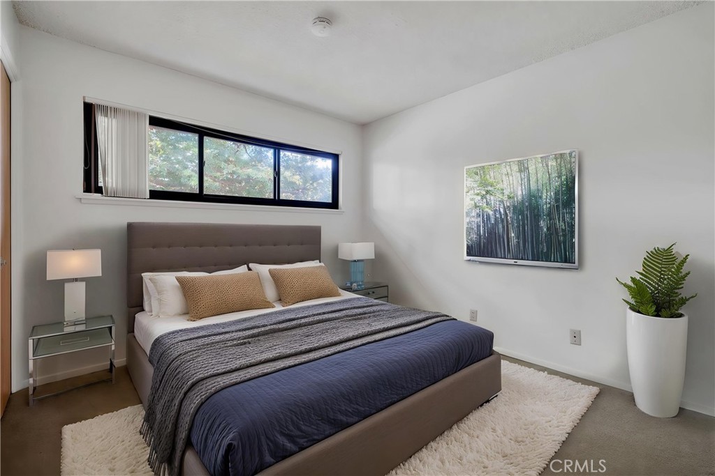 2727 San Ramon Drive Rancho Palos Verdes, CA 90275 - Photo 35 of 58 a bedroom with a large bed and a window