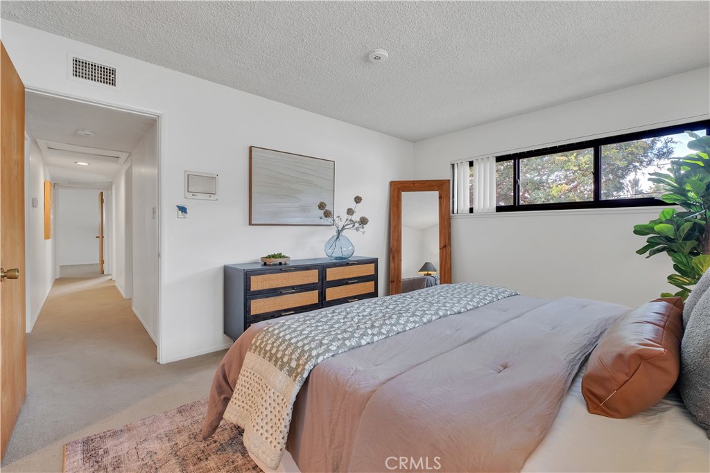 2727 San Ramon Drive Rancho Palos Verdes, CA 90275 - Photo 37 of 58 a bedroom with a bed and a couch