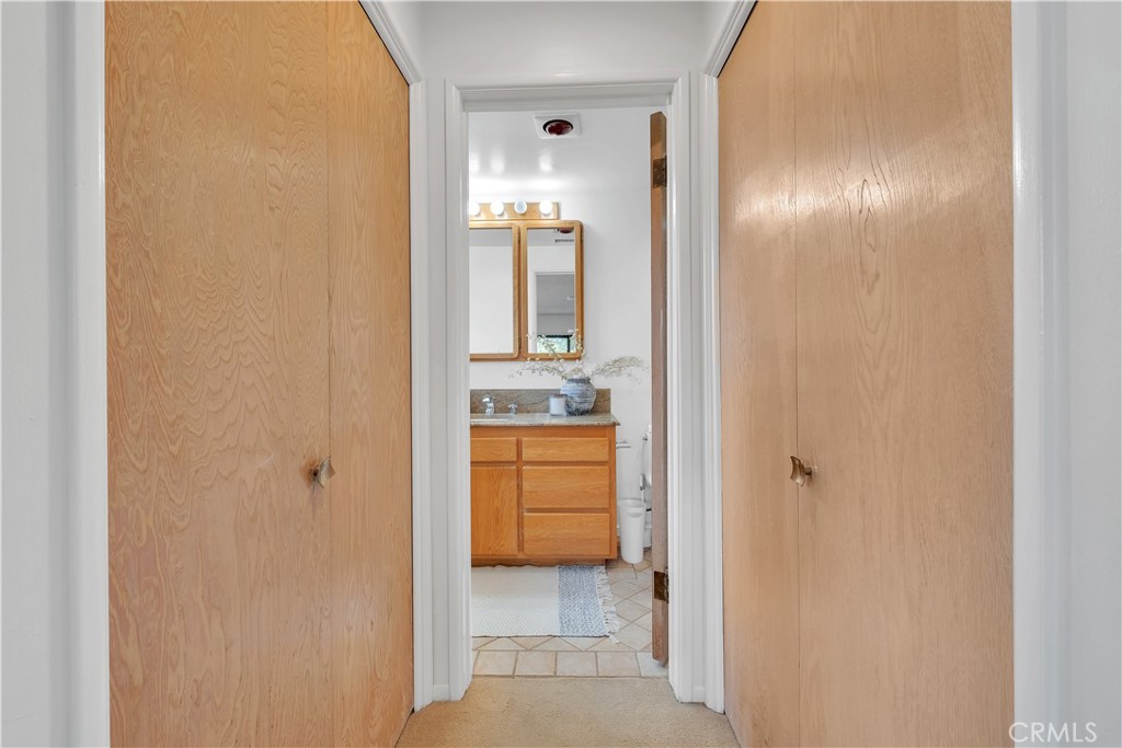 2727 San Ramon Drive Rancho Palos Verdes, CA 90275 - Photo 39 of 58 a bathroom with a double vanity sink and a mirror