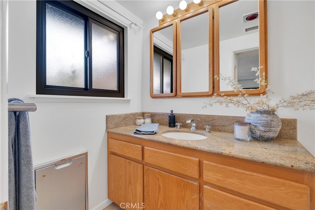 2727 San Ramon Drive Rancho Palos Verdes, CA 90275 - Photo 40 of 58 a bathroom with a granite countertop double vanity sink and mirror