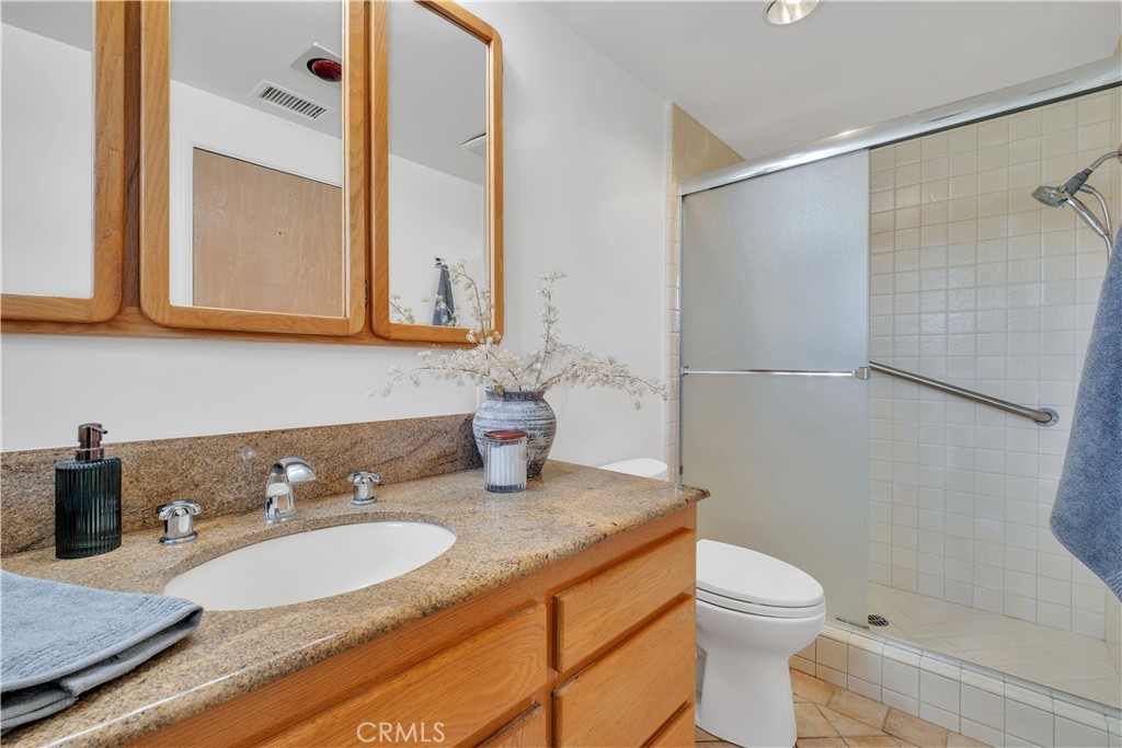 2727 San Ramon Drive Rancho Palos Verdes, CA 90275 - Photo 42 of 58 a bathroom with a granite countertop sink toilet and shower