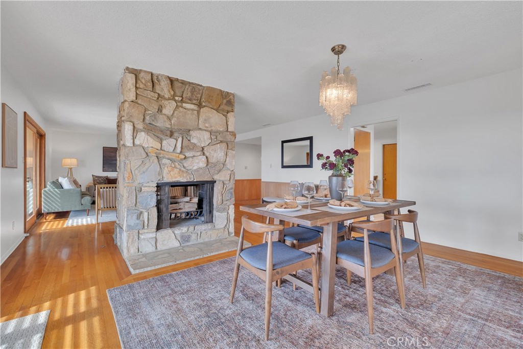 2727 San Ramon Drive Rancho Palos Verdes, CA 90275 - Photo 6 of 58 a view of a dining room with furniture a chandelier and wooden floor