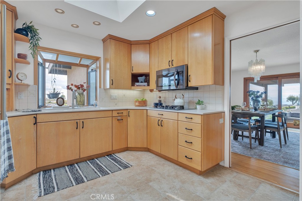 2727 San Ramon Drive Rancho Palos Verdes, CA 90275 - Photo 9 of 58 a kitchen with white cabinets and sink