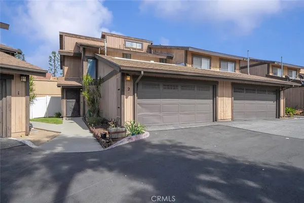 a front view of a house with a garage