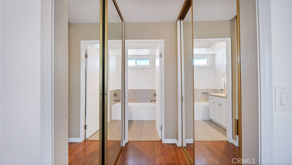 56 Wetstone, Unit 35 Irvine, CA 92604 - Photo 12 of 36 a view of a bathroom with a glass door