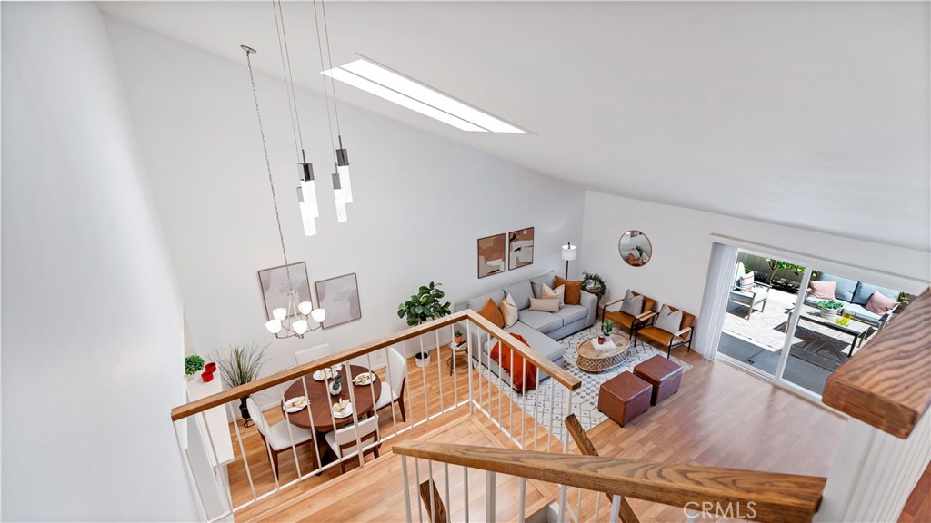56 Wetstone, Unit 35 Irvine, CA 92604 - Photo 23 of 36 a living room with furniture and wooden floor