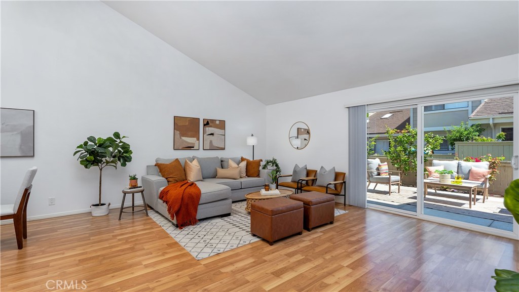56 Wetstone, Unit 35 Irvine, CA 92604 - Photo 24 of 36 a living room with furniture and a large window