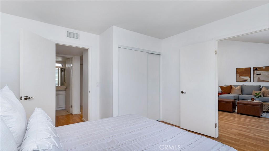 56 Wetstone, Unit 35 Irvine, CA 92604 - Photo 27 of 36 a bedroom with a bed and a couch