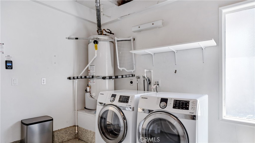 56 Wetstone, Unit 35 Irvine, CA 92604 - Photo 28 of 36 a view of a storage & utility room with dryer and washer