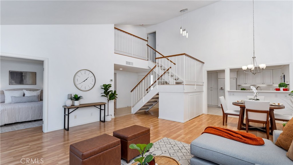 56 Wetstone, Unit 35 Irvine, CA 92604 - Photo 7 of 36 a living room with furniture and a wooden floor