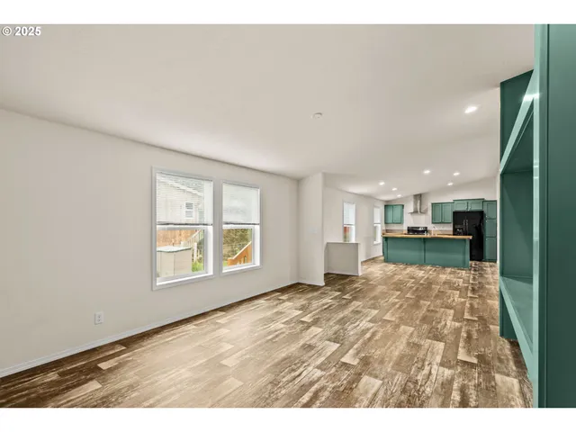 a view of livingroom with furniture and a window