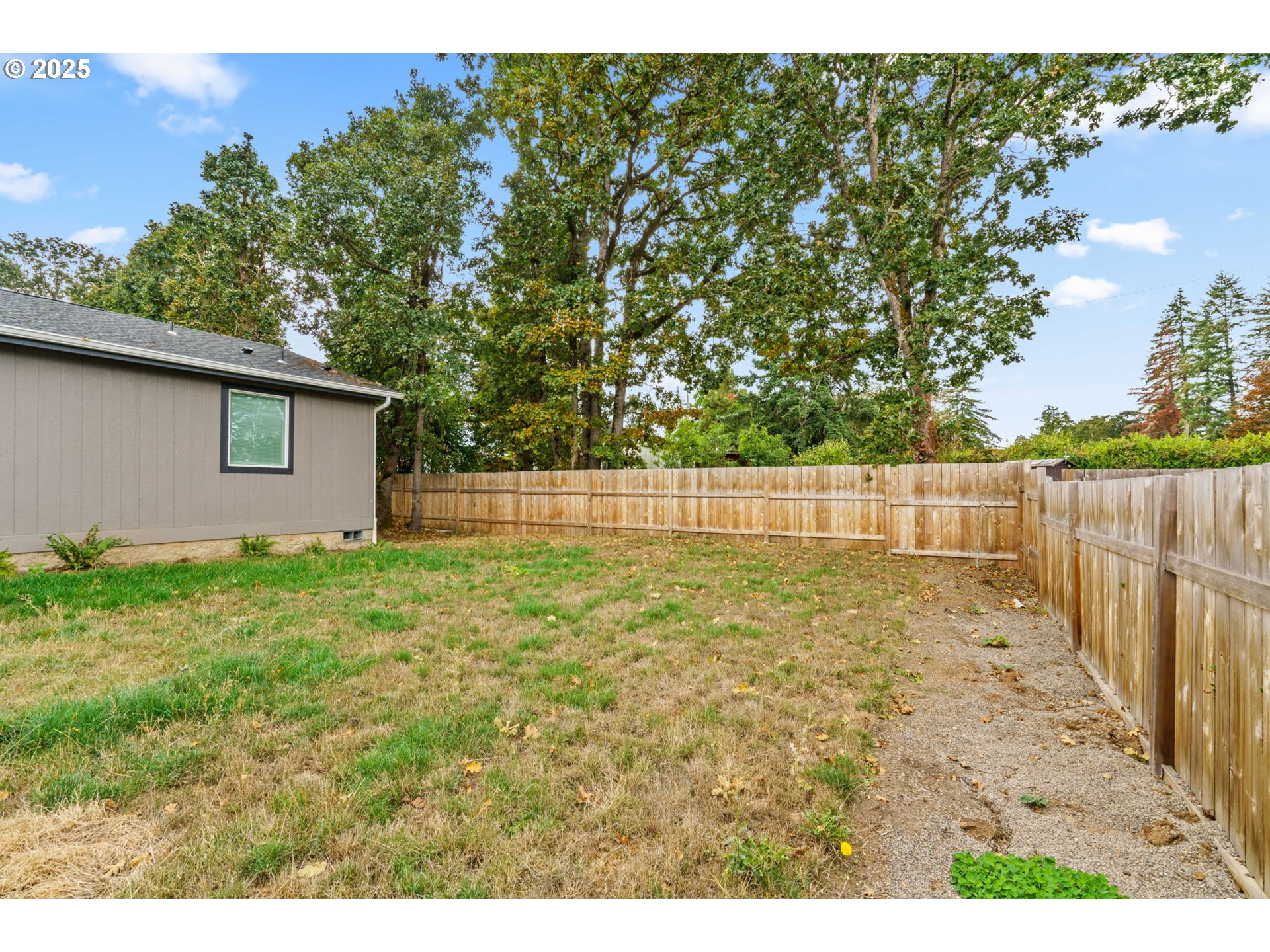 39009 Dexter Road, Unit 32 Dexter, OR 97431 - Photo 31 of 36 a view of backyard with wooden fence