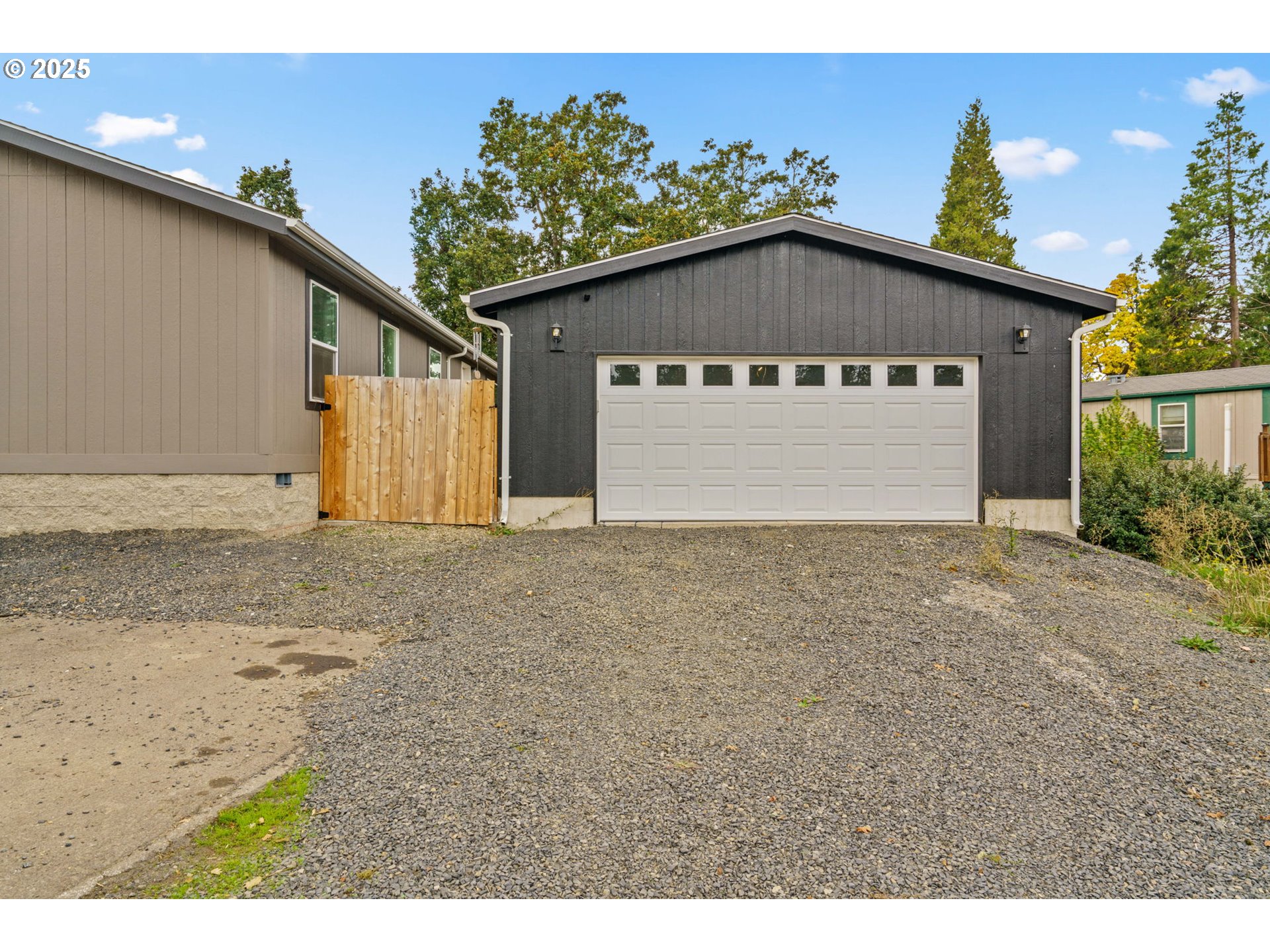 39009 Dexter Road, Unit 32 Dexter, OR 97431 - Photo 34 of 36 a front view of house with garage and yard