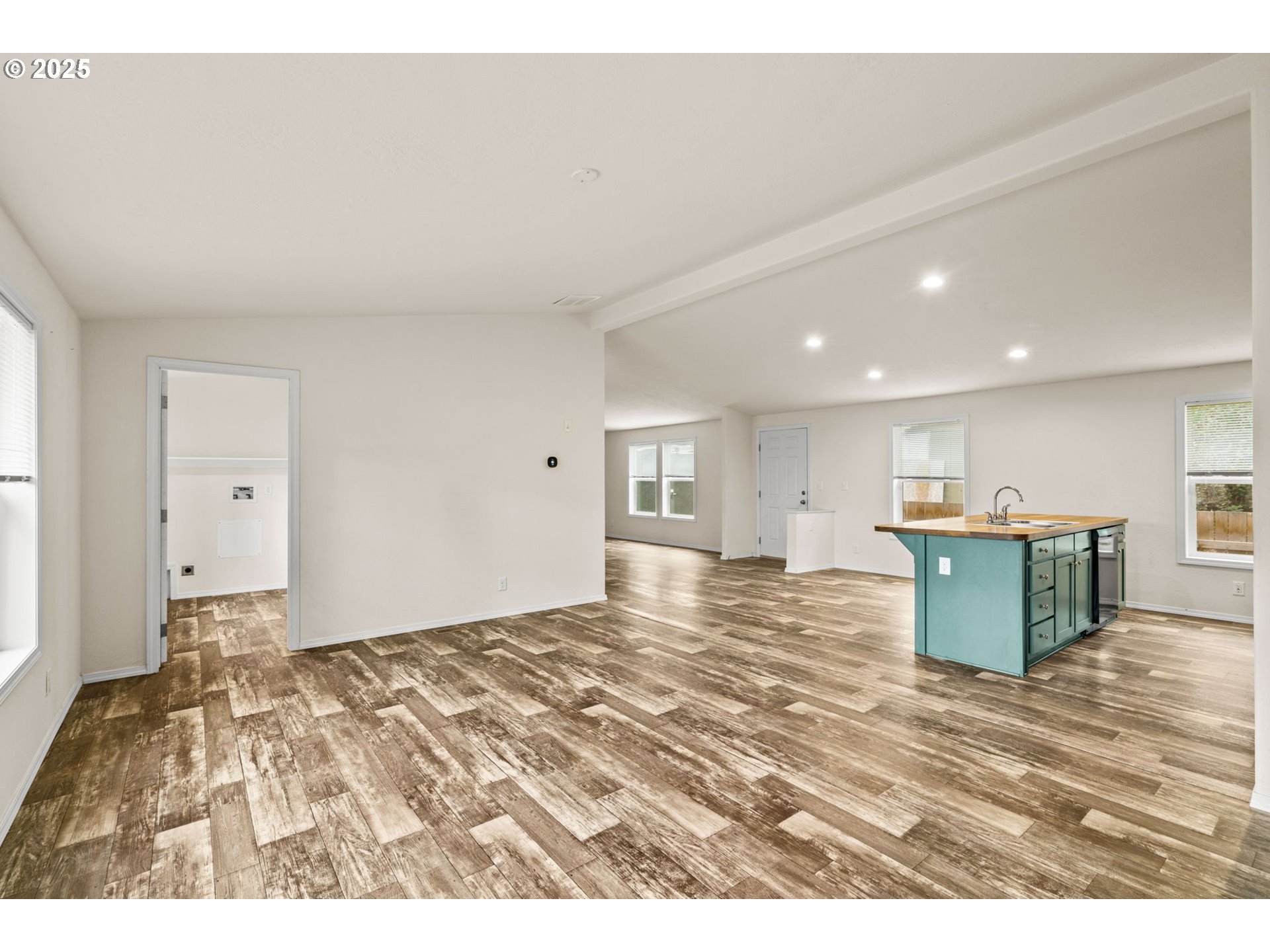 39009 Dexter Road, Unit 32 Dexter, OR 97431 - Photo 4 of 36 a view of a kitchen with kitchen island sink and refrigerator