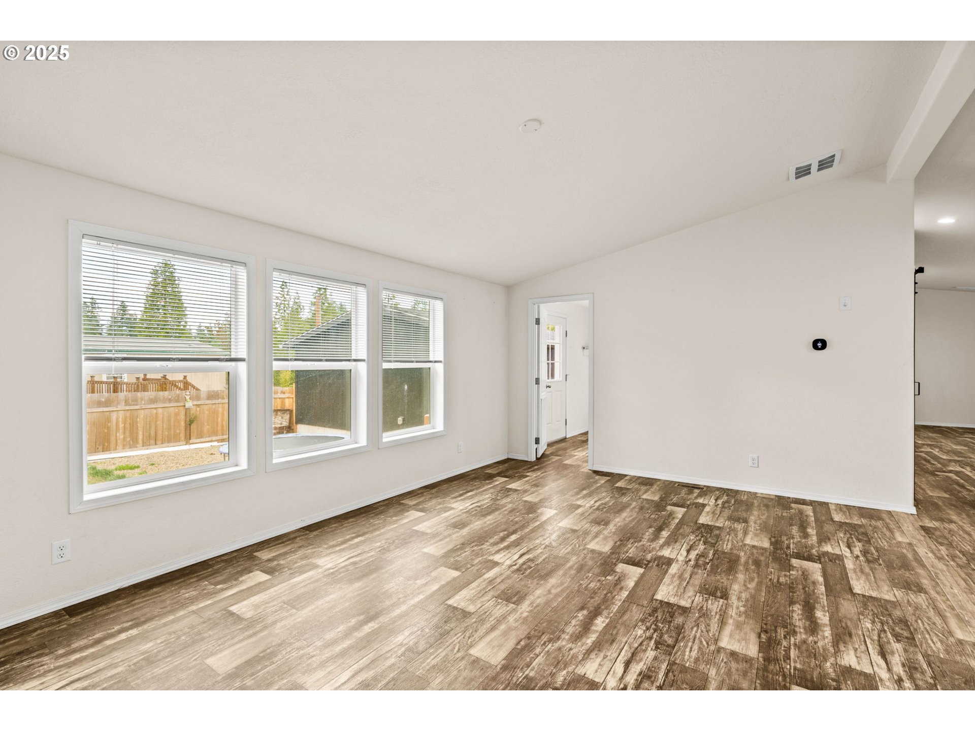 39009 Dexter Road, Unit 32 Dexter, OR 97431 - Photo 10 of 36 a view of an empty room with a window