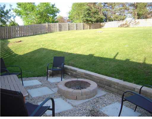Yard/Garden. Lage fenced in yard with firepit area.