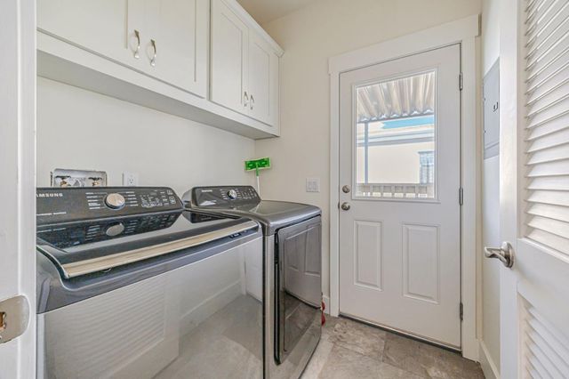 a kitchen with granite countertop a stove and a sink