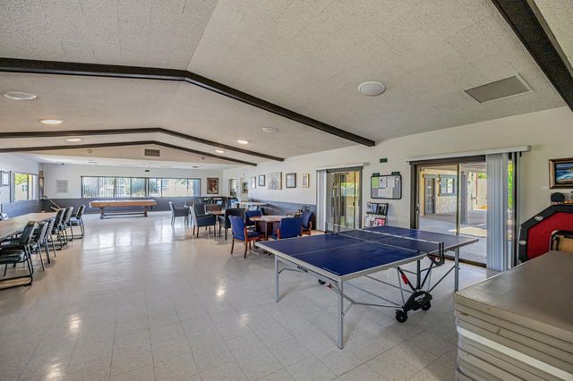 a view of a livingroom with furniture and white walls