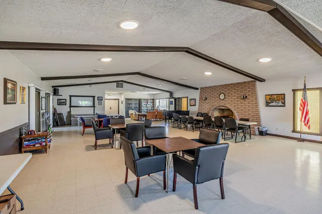 a view of a dining room with furniture and a livingroom