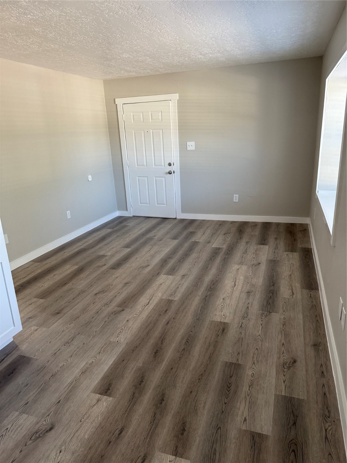 505 Waco Street, Unit 3 Conroe, TX 77301 - Photo 3 of 10 Luxury vinyl plank flooring runs throughout the main living areas, creating a fresh, cohesive look.