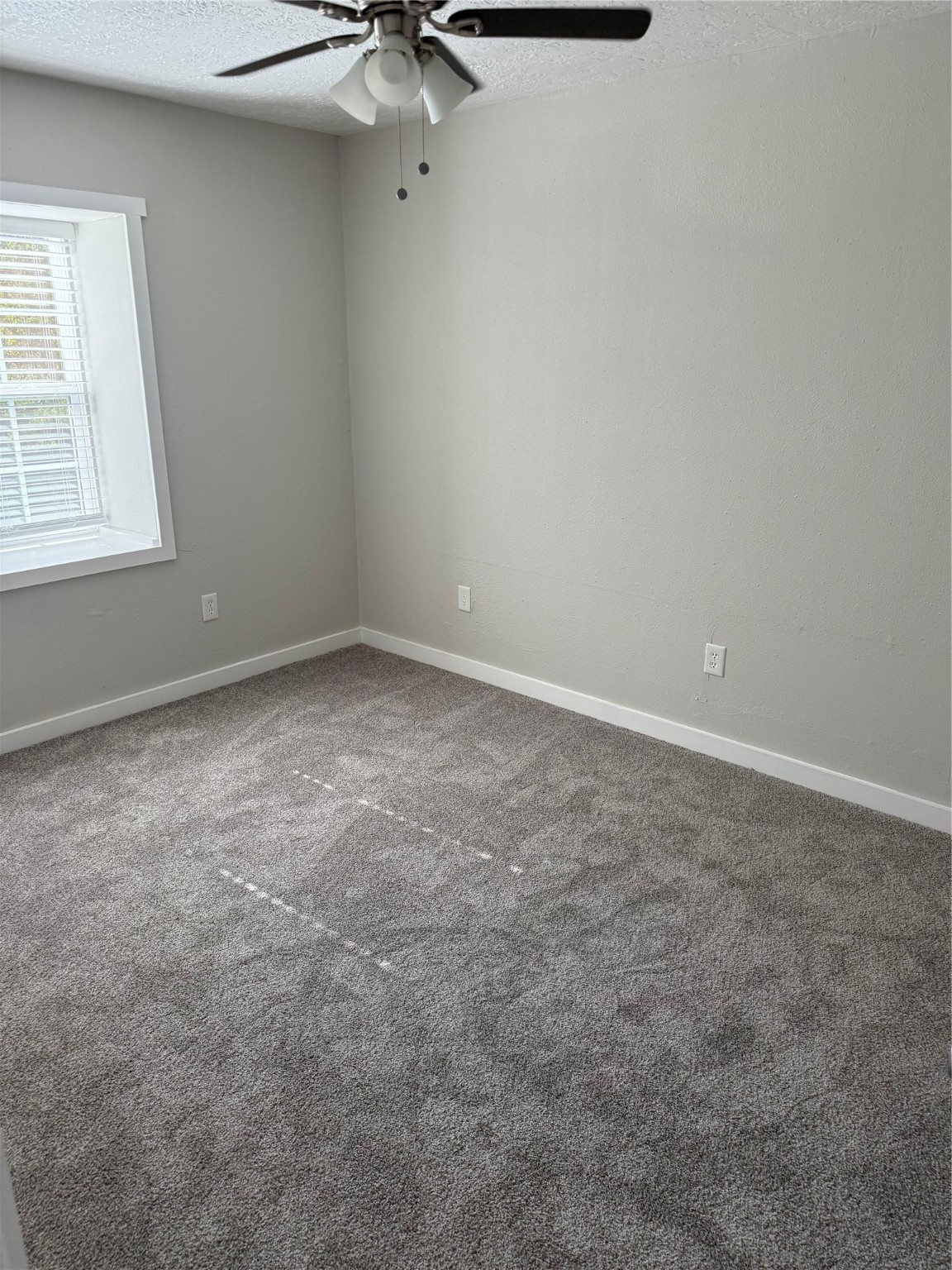 505 Waco Street, Unit 3 Conroe, TX 77301 - Photo 7 of 10 Bedrooms are well-sized and filled with natural light. Neutral paint tones throughout make the space easy to personalize