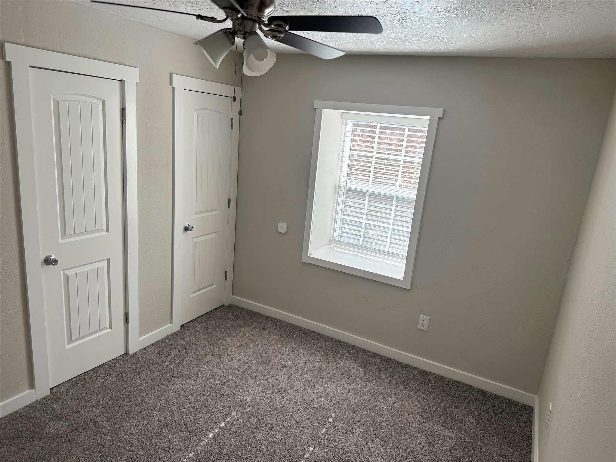 505 Waco Street, Unit 3 Conroe, TX 77301 - Photo 8 of 10 Bedrooms are well-sized and filled with natural light. Neutral paint tones throughout make the space easy to personalize