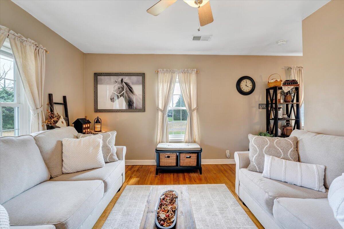 898 Mica Road Ridgeway, VA 24148 - Photo 21 of 60 a living room with furniture and a large window