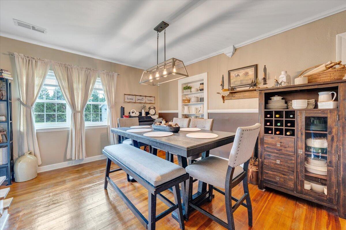 898 Mica Road Ridgeway, VA 24148 - Photo 24 of 60 a view of a dining room with furniture window and wooden floor