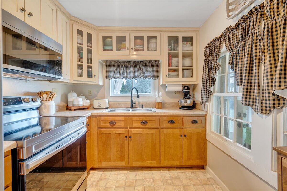 898 Mica Road Ridgeway, VA 24148 - Photo 27 of 60 a kitchen with stainless steel appliances granite countertop a sink and cabinets