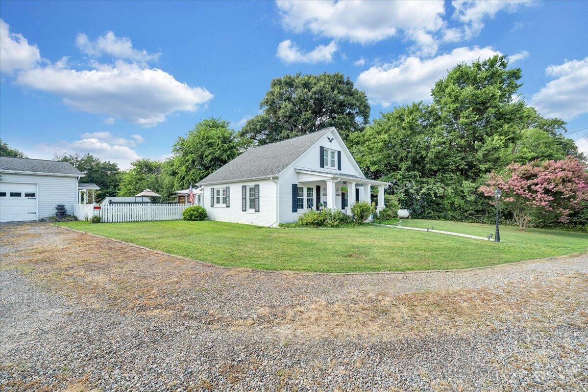 898 Mica Road Ridgeway, VA 24148 - Photo 7 of 60 a front view of a house with a yard and garage