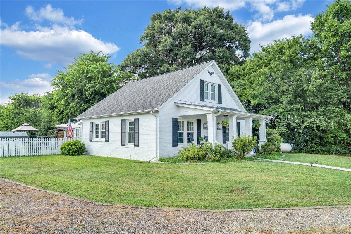 898 Mica Road Ridgeway, VA 24148 - Photo 10 of 60 a front view of a house with a garden