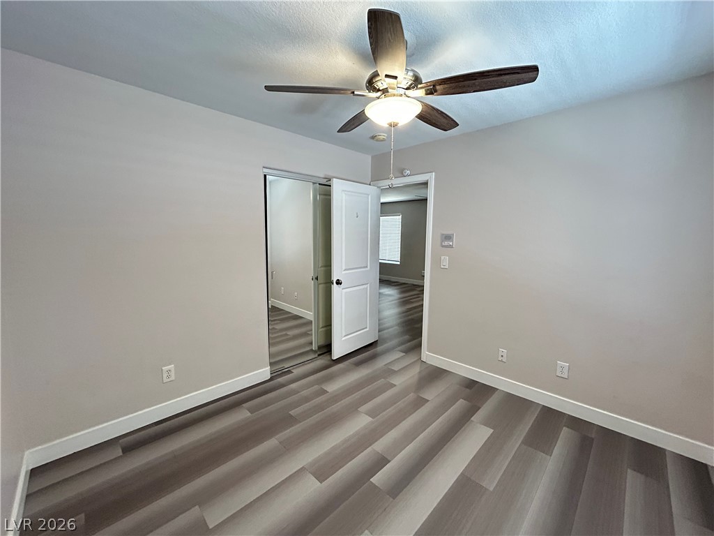 6538 Elm Spring Las Vegas, NV 89148 - Photo 17 of 29 Modern plank flooring defines this versatile room, ready for your personal touch.