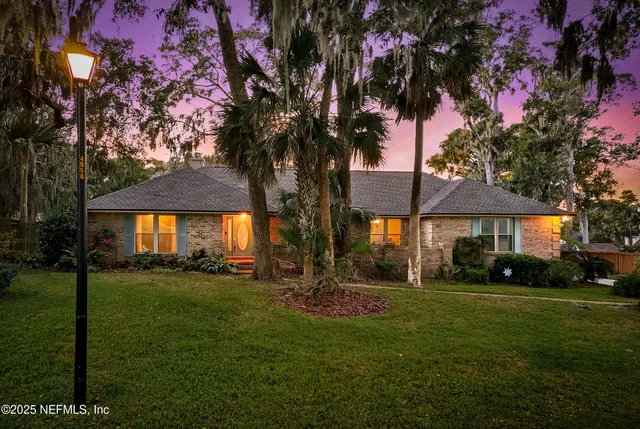 a view of house with yard