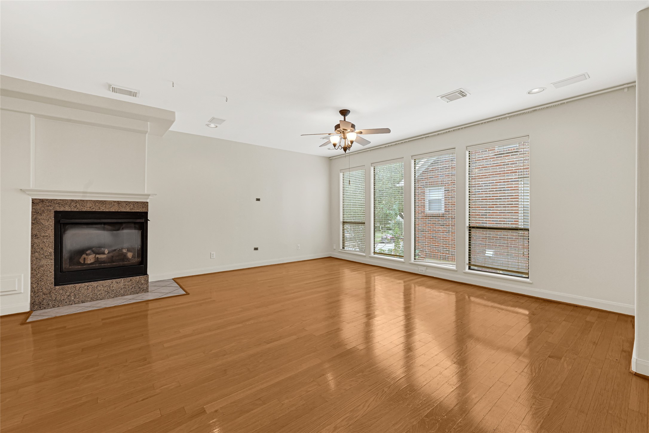 2414 Calumet Street, Unit B Houston, TX 77004 - Photo 8 of 27 a view of an empty room with a fireplace and a window