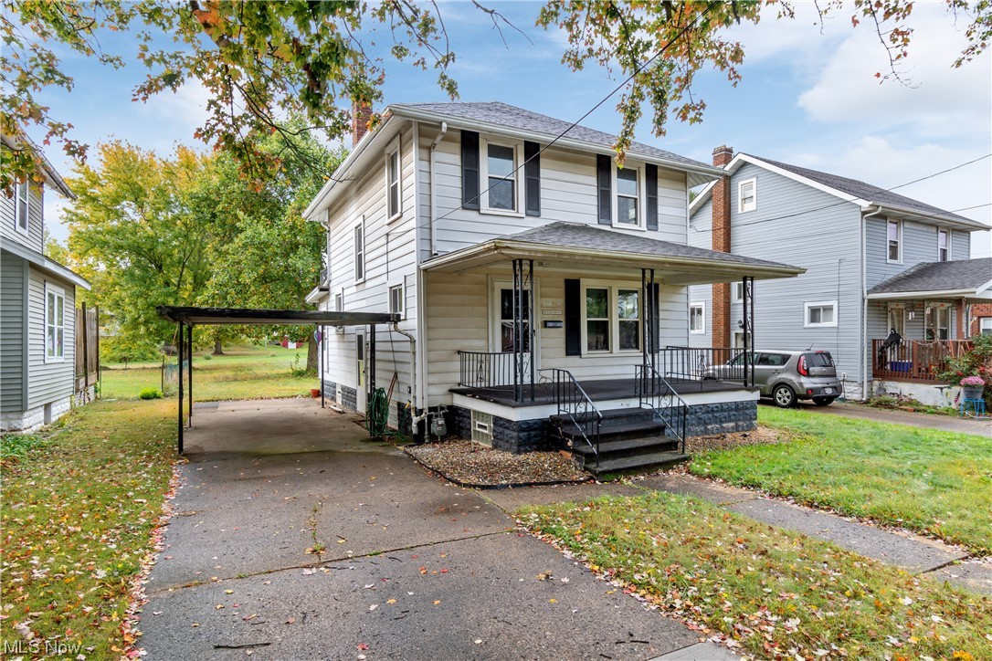 1529 Walnut Road Southwest Massillon, OH 44647 - Photo 2 of 27 View of front facade with covered porch and a front yard