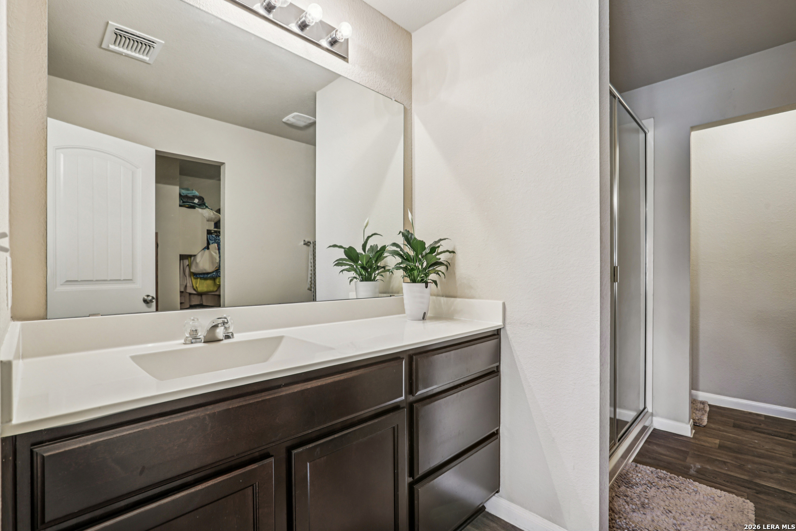 12103 Riprap Drive Manor, TX 78653 - Photo 11 of 13 a bathroom with a sink and a mirror