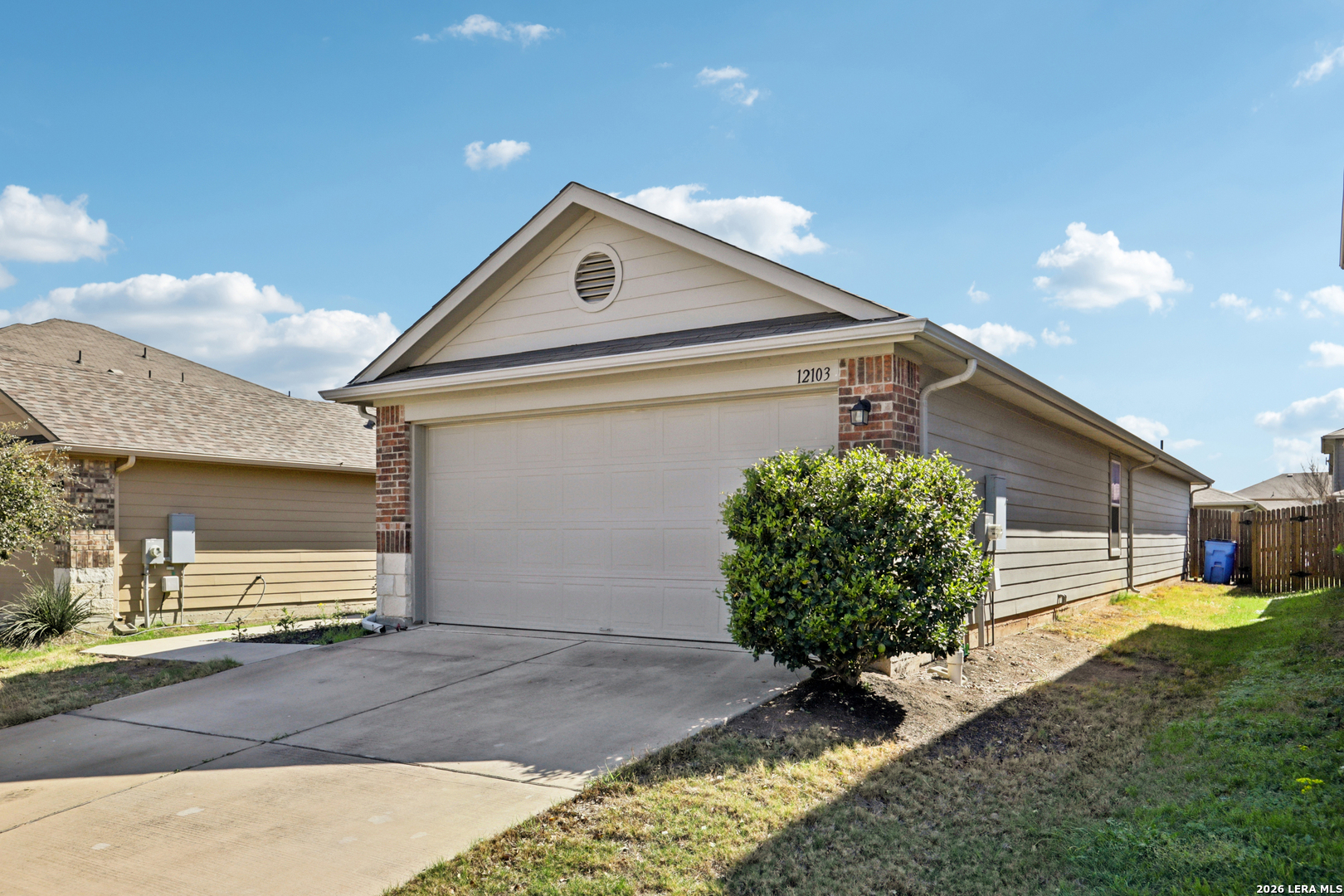 12103 Riprap Drive Manor, TX 78653 - Photo 2 of 13 a front view of a house with garden