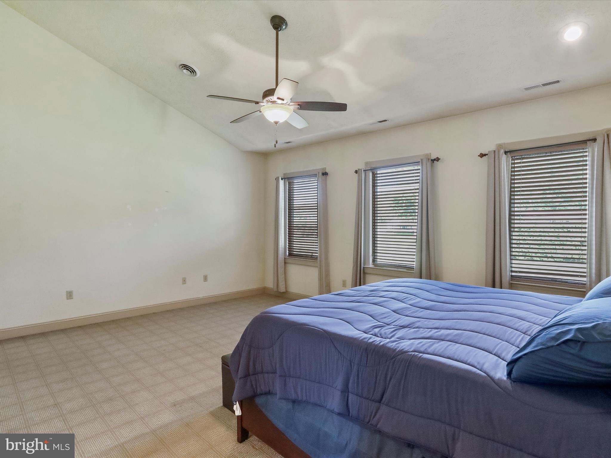 15 Rachels Ln Road Front Royal, VA 22630 - Photo 34 of 73 a bedroom with a large bed and a ceiling fan