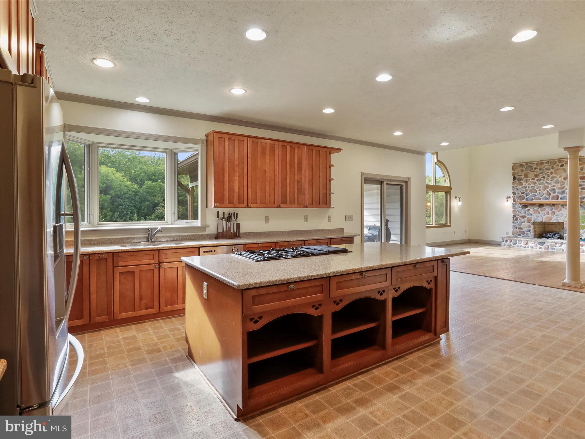 15 Rachels Ln Road Front Royal, VA 22630 - Photo 47 of 73 a kitchen with kitchen island granite countertop a stove and a sink