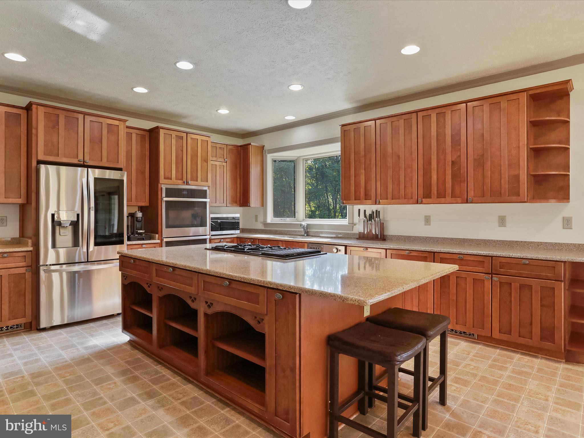 15 Rachels Ln Road Front Royal, VA 22630 - Photo 48 of 73 a large kitchen with stainless steel appliances granite countertop a stove a sink and a microwave