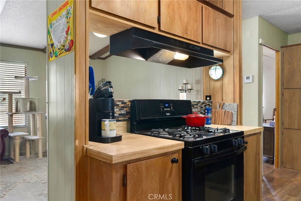 3835 Gardiner Ferry Road, Unit 2 Corning, CA 96021 - Photo 17 of 51 a kitchen with a stove and a cabinets