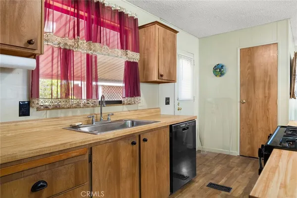 a kitchen with a sink and a window